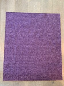 Purple paisley cotton backing of handmade baby quilt